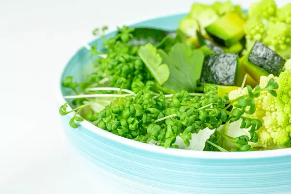 Close-up of a bowl of fresh vegetable salad and watercress (Flip 2020)