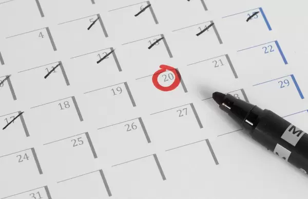 Close up of a calendar with some days crossed off