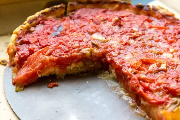 Close-up of a cheese and tomato pizza made by Pizzeria Uno: the birthplace of Deep Dish Pizza