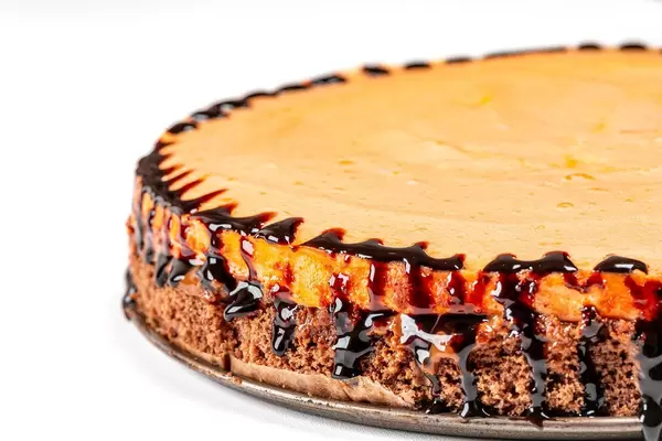 Close-up of a chocolate cake with peach meringue (Flip 2020)