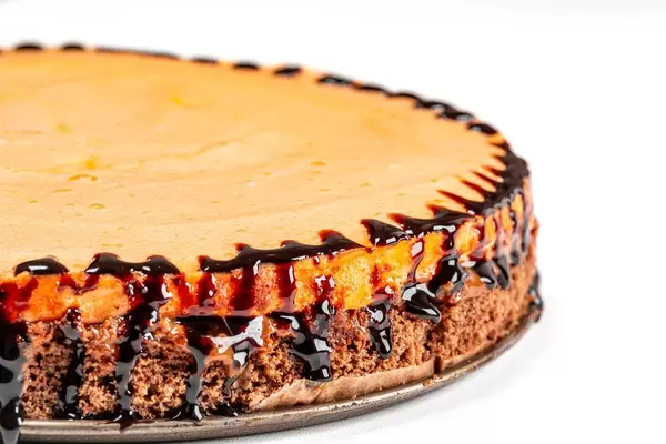 Close-up of a chocolate cake with peach meringue