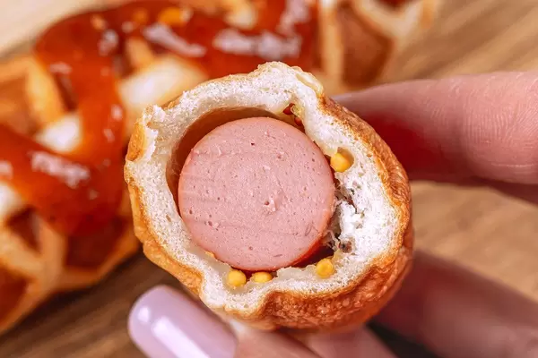 Close-up of a cut Corn Dog in a waffle (Flip 2020)