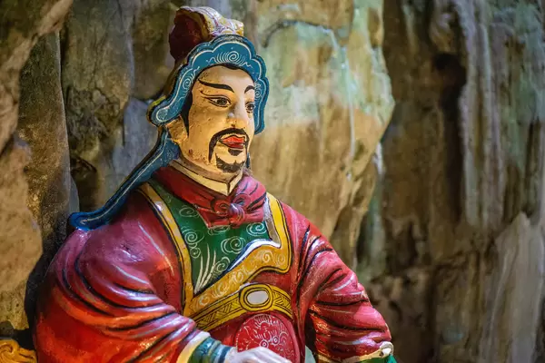 Close Up of a Painted Statue of the God of the Gate at the Entrance of a Cave at Marble Mountains in Da Nang, Vietnam