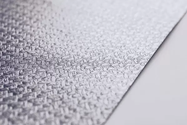 Close up of a paper texture. Silver decorative paper.