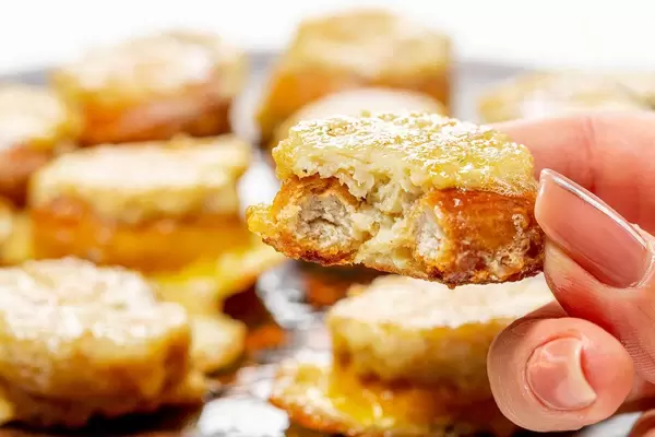 Close up of a piece of stuffed bun in a woman's hand (Flip 2019)