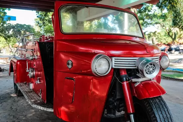 Close up of a red trike that served as a fire department vehicle
