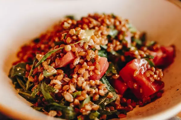Close up of a salad with avocado and spelled