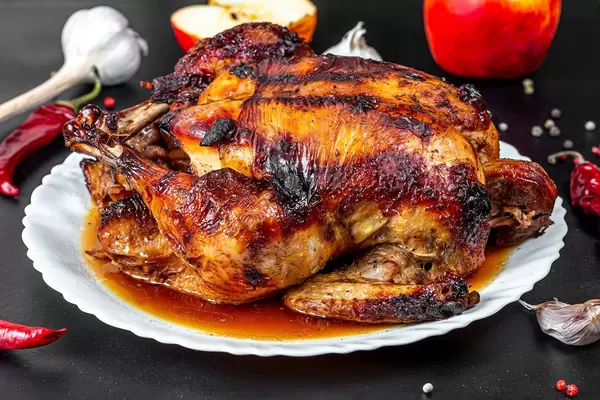 Close up of baked chicken with apples (Flip 2019)