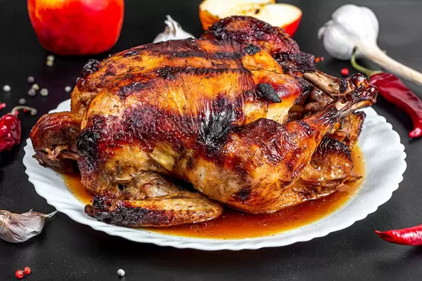 Close up of baked chicken with apples