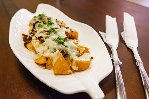 Close up of baked potatoes with cream sauce (Flip 2019)