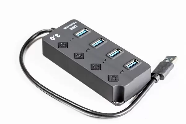 Close-up of black USB hub on white background
