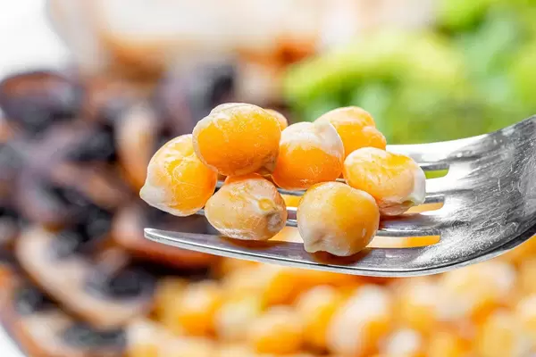 Close up of boiled chickpeas on a fork (Flip 2019)