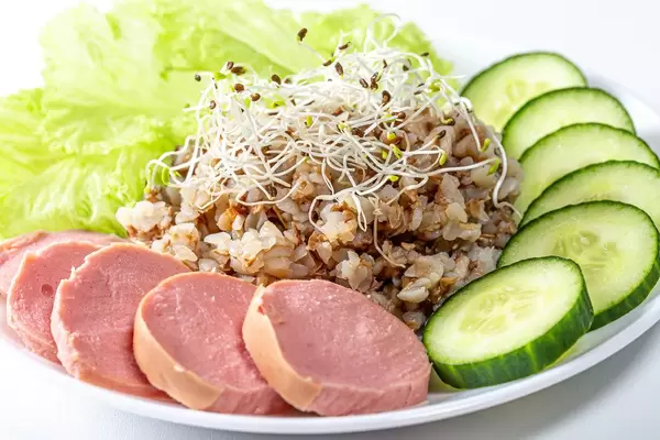 Close-up of buckwheat with sausage, alfalfa micro-greens and vegetables (Flip 2019)