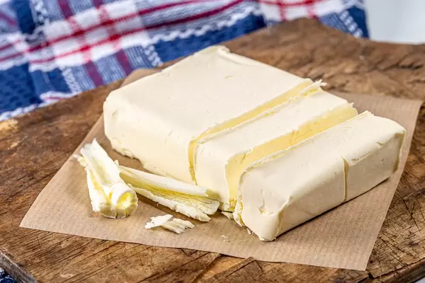 Close-up of butter on an old kitchen Board (Flip 2020)