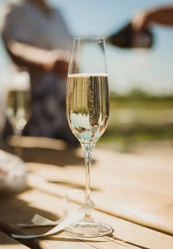 Close Up Of Champagne Glass On The Wooden Table