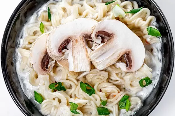 Close-up of cheese and mushroom soup with pasta (Flip 2019)