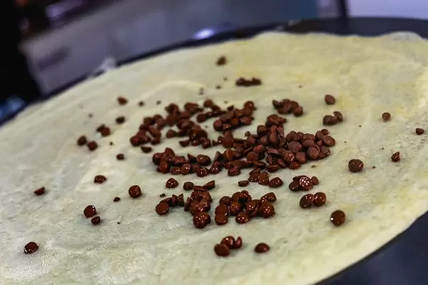 Close up of chocolate chips on top of crepe (Flip 2019)