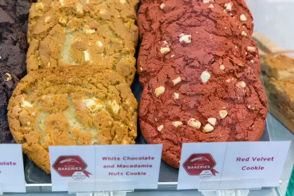 Close-up of colorful red Velvet cookie and white Chocolate and Macadamia Nuts Cookie