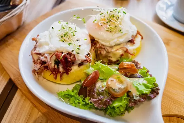 Close up of corned beef burger meal with poached egg (Flip 2019)