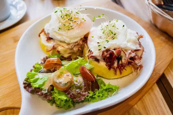 Close up of corned beef burger meal with poached egg