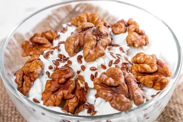 Close-up of cottage cheese dessert with walnuts and flax seeds (Flip 2019)