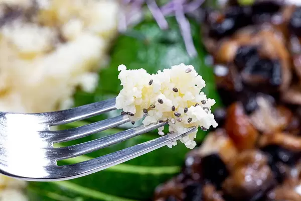Close-up of couscous with Chia seeds on a fork. Healthy eating concept (Flip 2019)