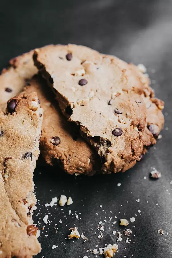 Close up of crushed chocolate cookie on black background.