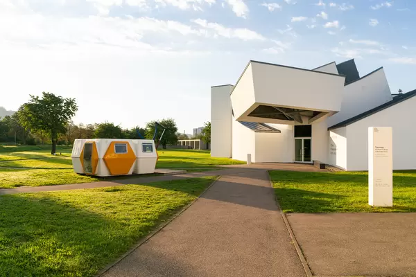 Close up of cubical haus and modern plastic exhibition pavilion in Vitra Museum of Design