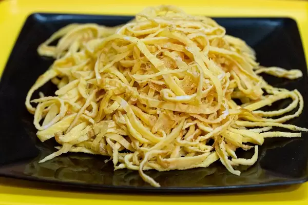 Close up of egg omelette cut into strips (Flip 2019)