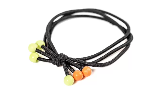 Close-up of elastic bands on white background