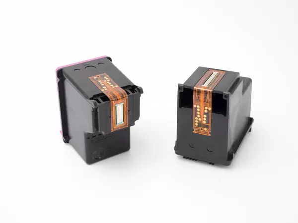 Close-up of empty ink cartridges on white background