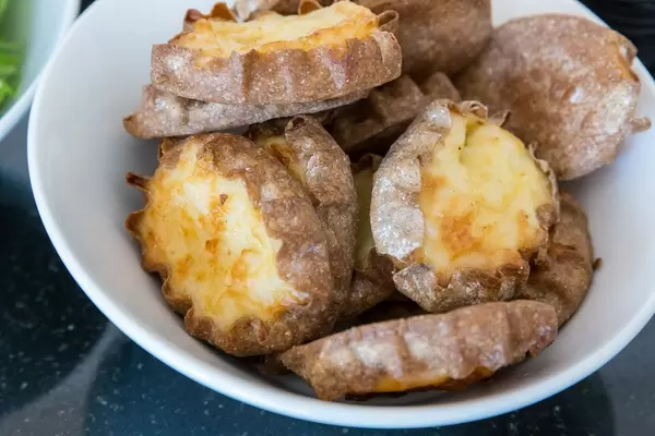 Close-up of Finnish national speciality and typical dish "Karjalanpiirakka": filled Karelian pirogge with thin pastry crust
