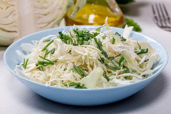 Close - up of fresh cabbage salad with leeks (Flip 2019)