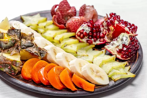 Close up of fresh exotic fruit slices on a plate (Flip 2019)