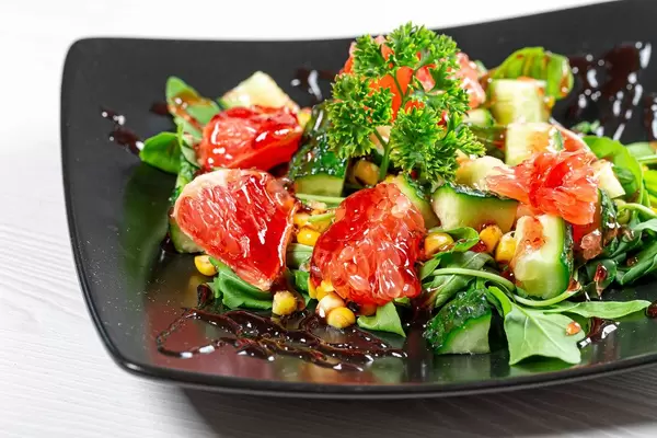 Close-up of fruit and vegetable salad with pomegranate sauce (Flip 2019)