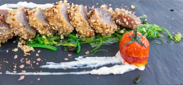 Close-up of fusion dish at Q11 restaurant in Pollença, Mallorca. Red tuna "tataki" with soya mayonnaise