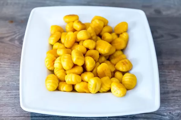 Close-up of gnocchi with pumpkin seeds