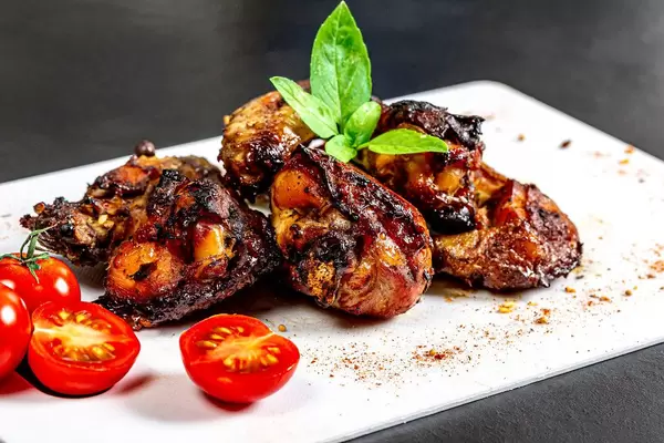 Close-up of golden pieces of baked chicken