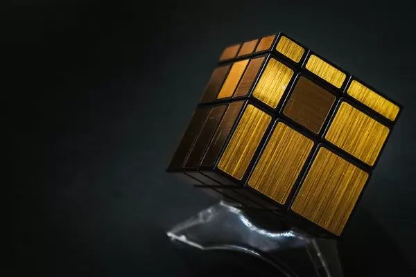 Close up of golden puzzle cube