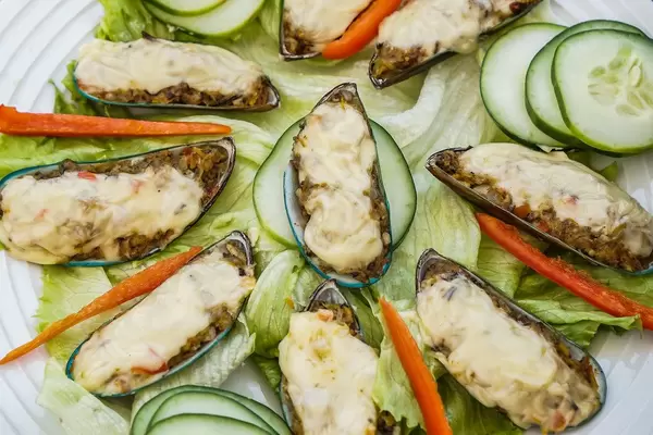 Close up of green shell mussels in cream cheese (Flip 2019)
