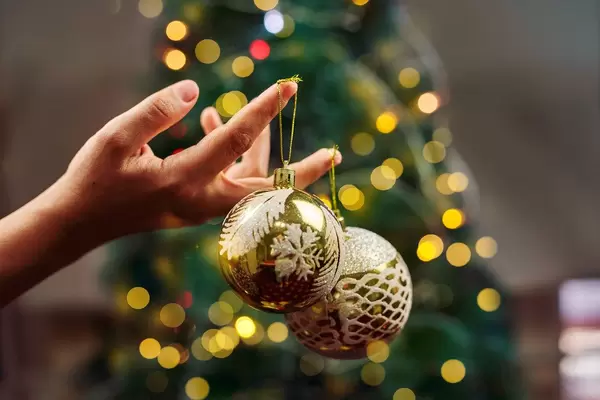 Close-up of hand holding Christmas baubles