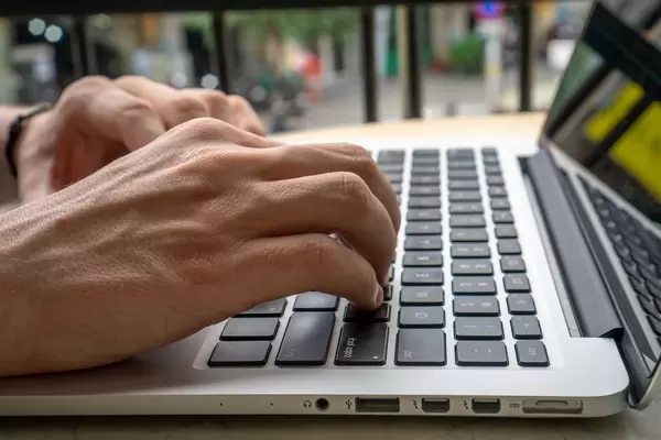 Close Up of Hands on a Laptop Keyboard  Flip 2019