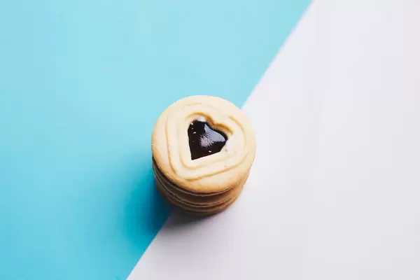 Close up of heart shaped cookies on colorful background.
