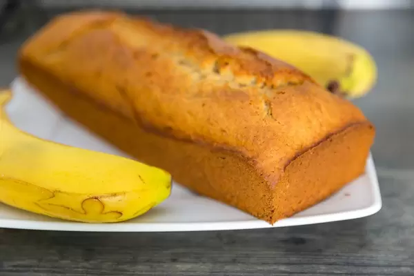 Close-up of homemade crispy banana bread on a white plate