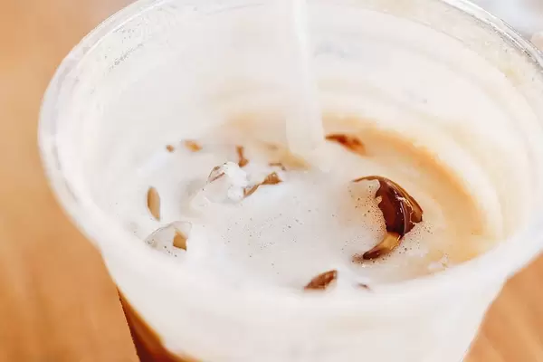 Close up of ice cappuccino in a plastic cup