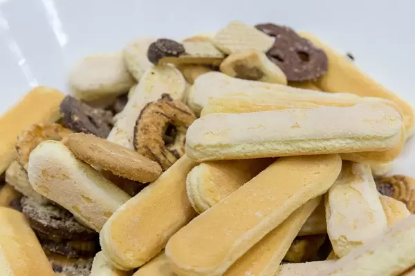 Close-up of ladyfingers and different kind of chocolate biscuits in white bowl at the BarCamp in  Bonn