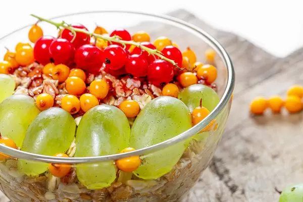 Close up of oatmeal with fresh berries in a glass bowl (Flip 2019)