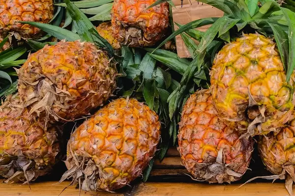 Close up of pineapples on sale