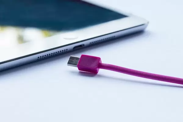 Close-up of pink cable for charging a smartphone or tablet