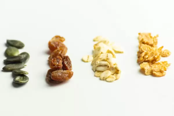 Close-up of pumpkin seeds, resins, oat flakes and corn flakes